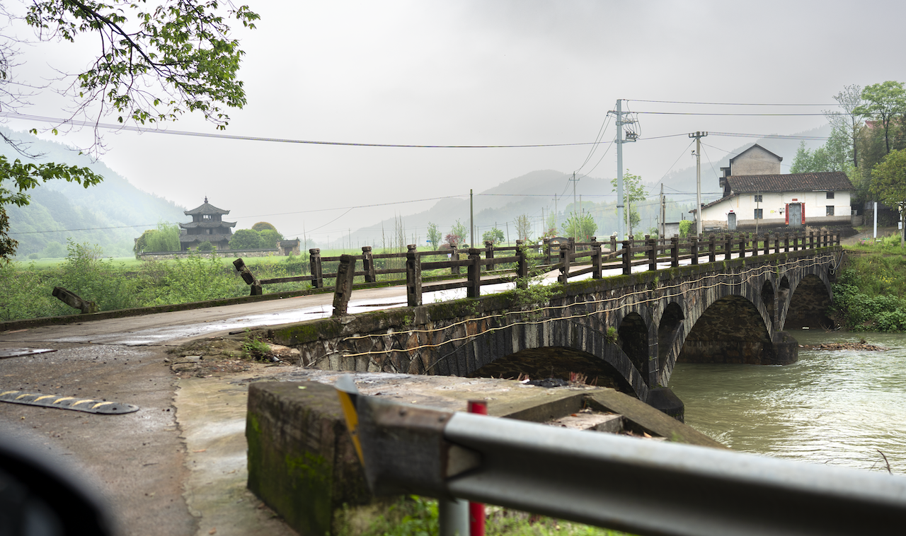 The old stone arch bridge leading into Guangdu Cun.